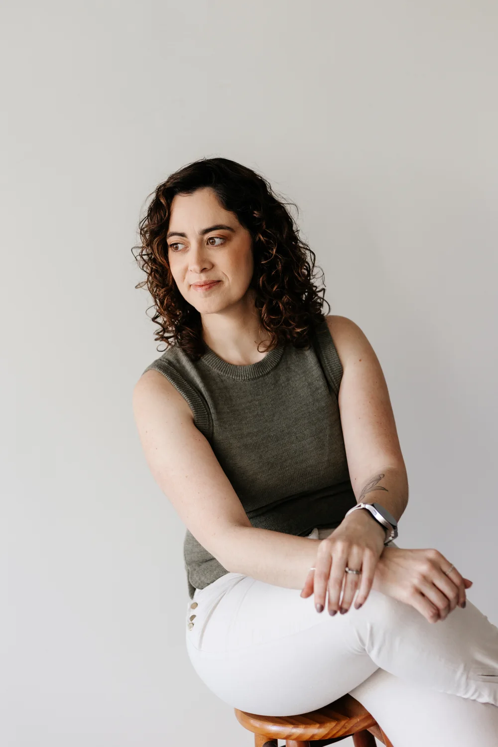 Carol Loiacono, seated in a green blouse.